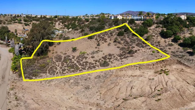 a view of a swimming pool with a yard and mountain view