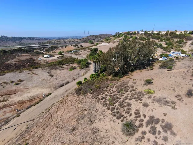 a view of a beach with a mountain in the background