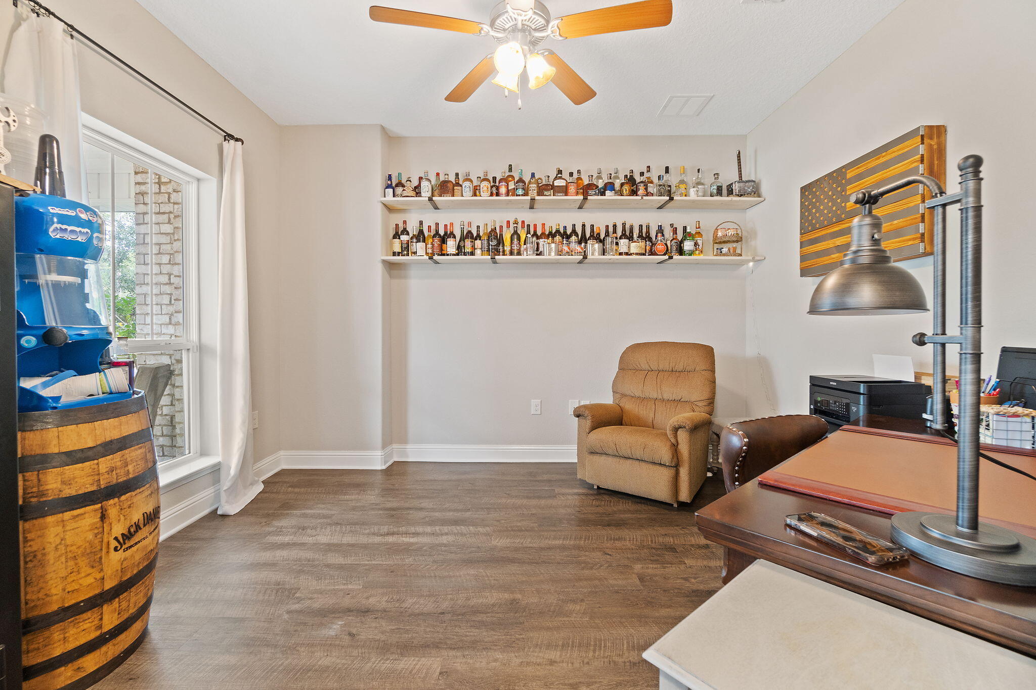 6955 Snug Waters Road Navarre, FL 32566 - Photo 13 of 45 a living room with furniture and a chandelier