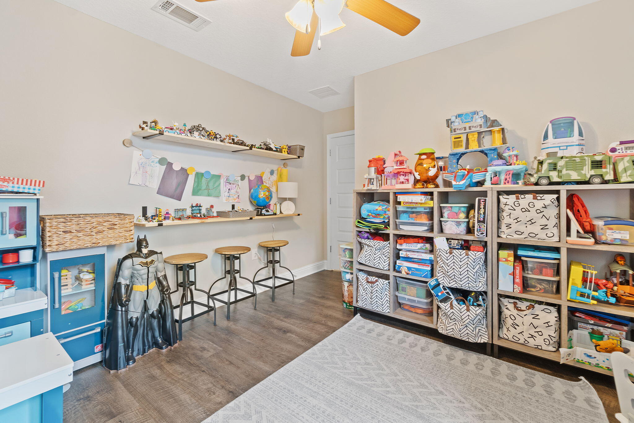 6955 Snug Waters Road Navarre, FL 32566 - Photo 24 of 45 a living room with lots of furniture and clutter