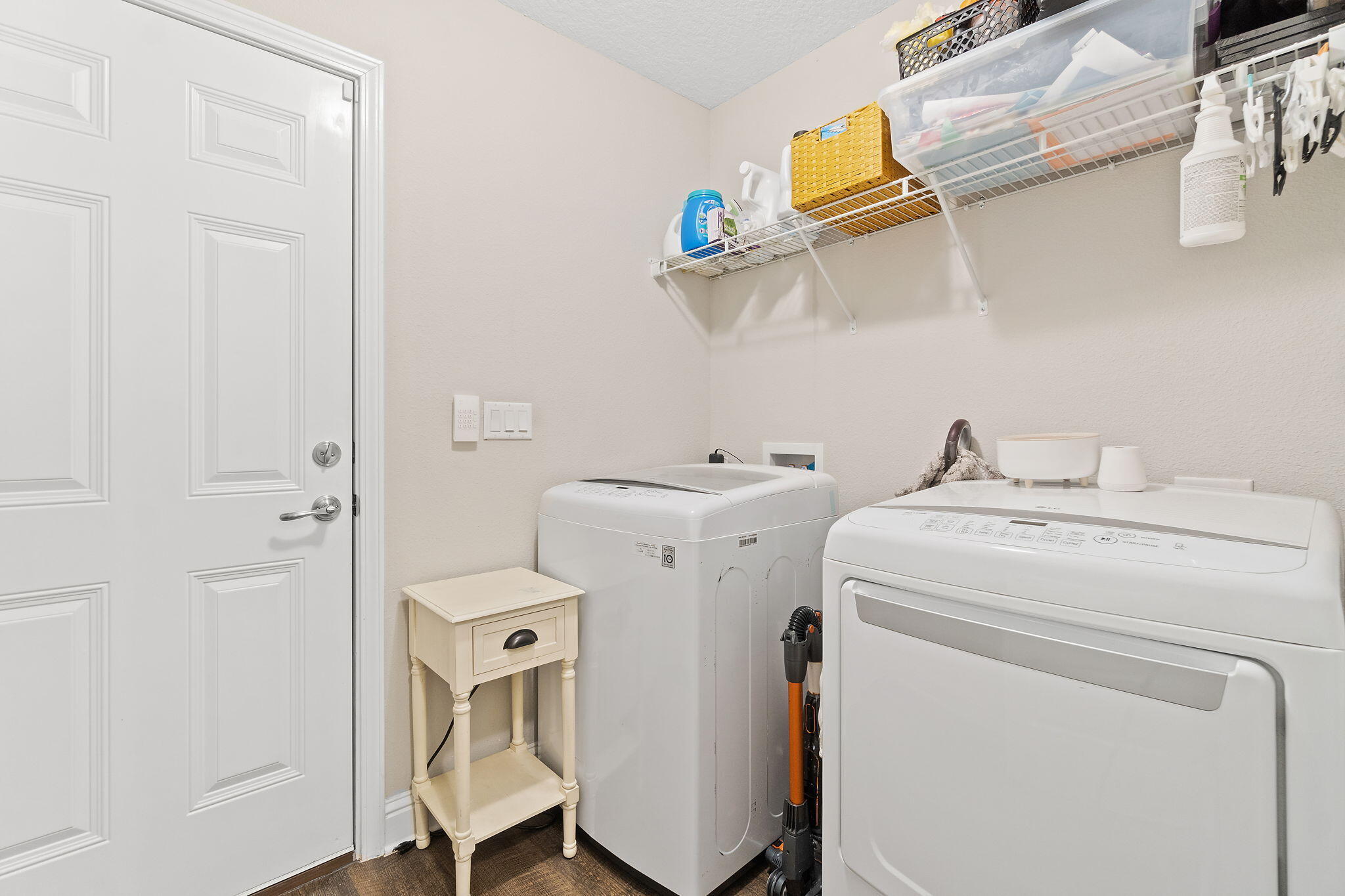 6955 Snug Waters Road Navarre, FL 32566 - Photo 25 of 45 a utility room with dryer and washer