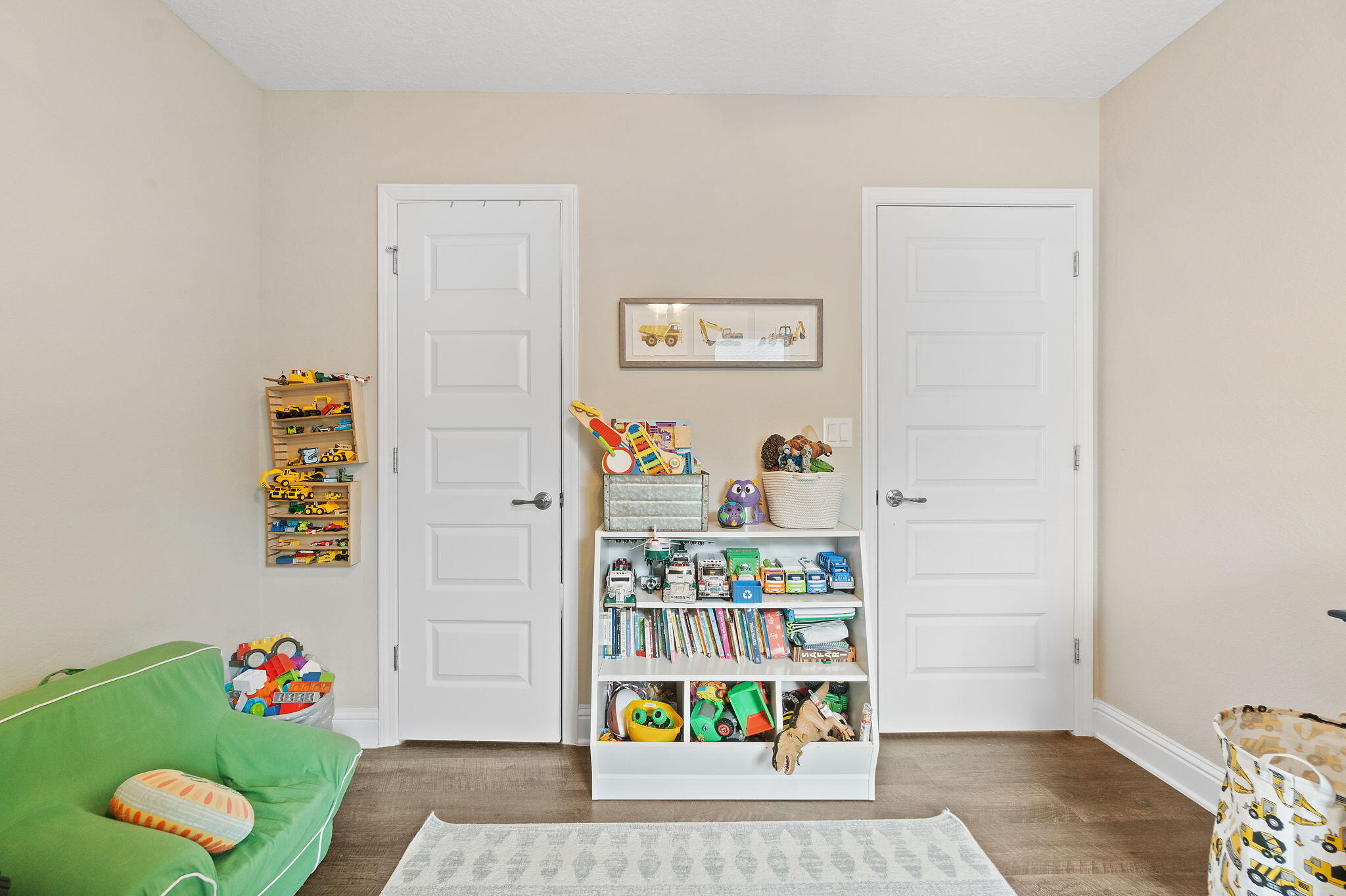 6955 Snug Waters Road Navarre, FL 32566 - Photo 27 of 45 a room with toys and dresser with wooden floor