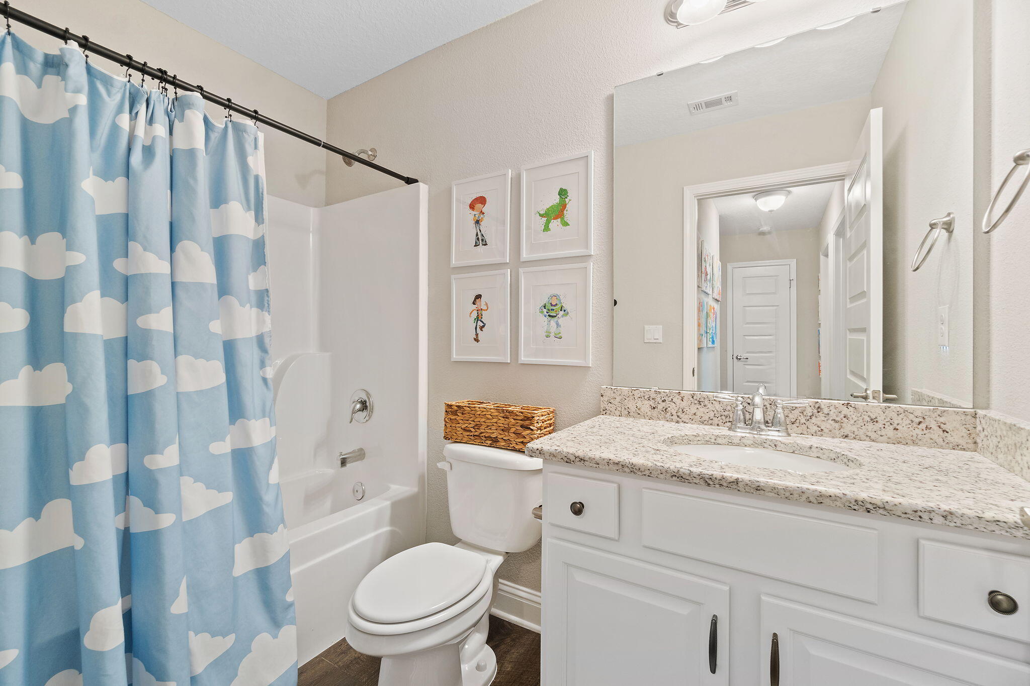 6955 Snug Waters Road Navarre, FL 32566 - Photo 30 of 45 a bathroom with a granite countertop sink a toilet and shower
