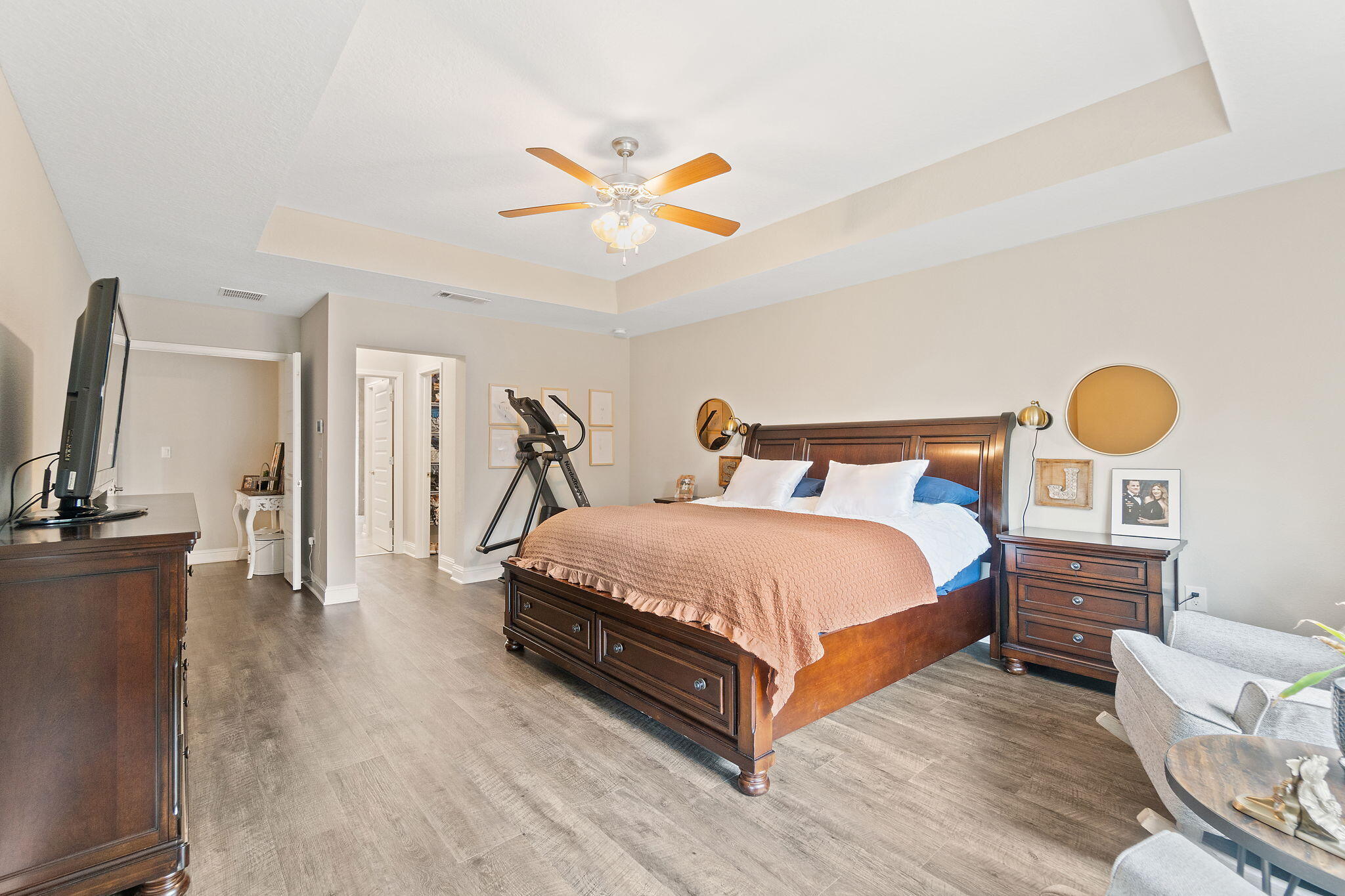 6955 Snug Waters Road Navarre, FL 32566 - Photo 33 of 45 a bedroom with a bed and a flat screen tv