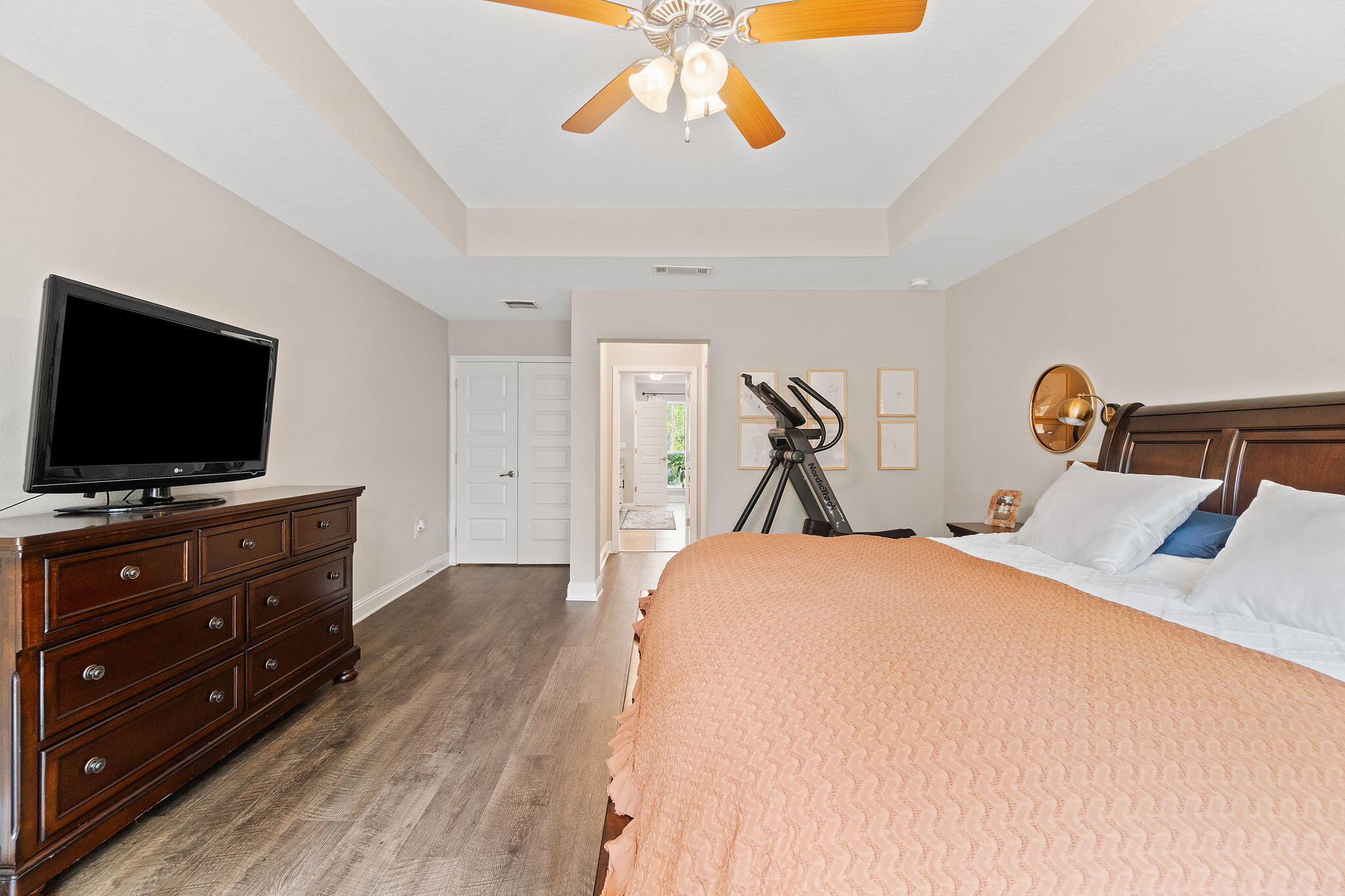 6955 Snug Waters Road Navarre, FL 32566 - Photo 34 of 45 a bedroom with a bed and a flat screen tv