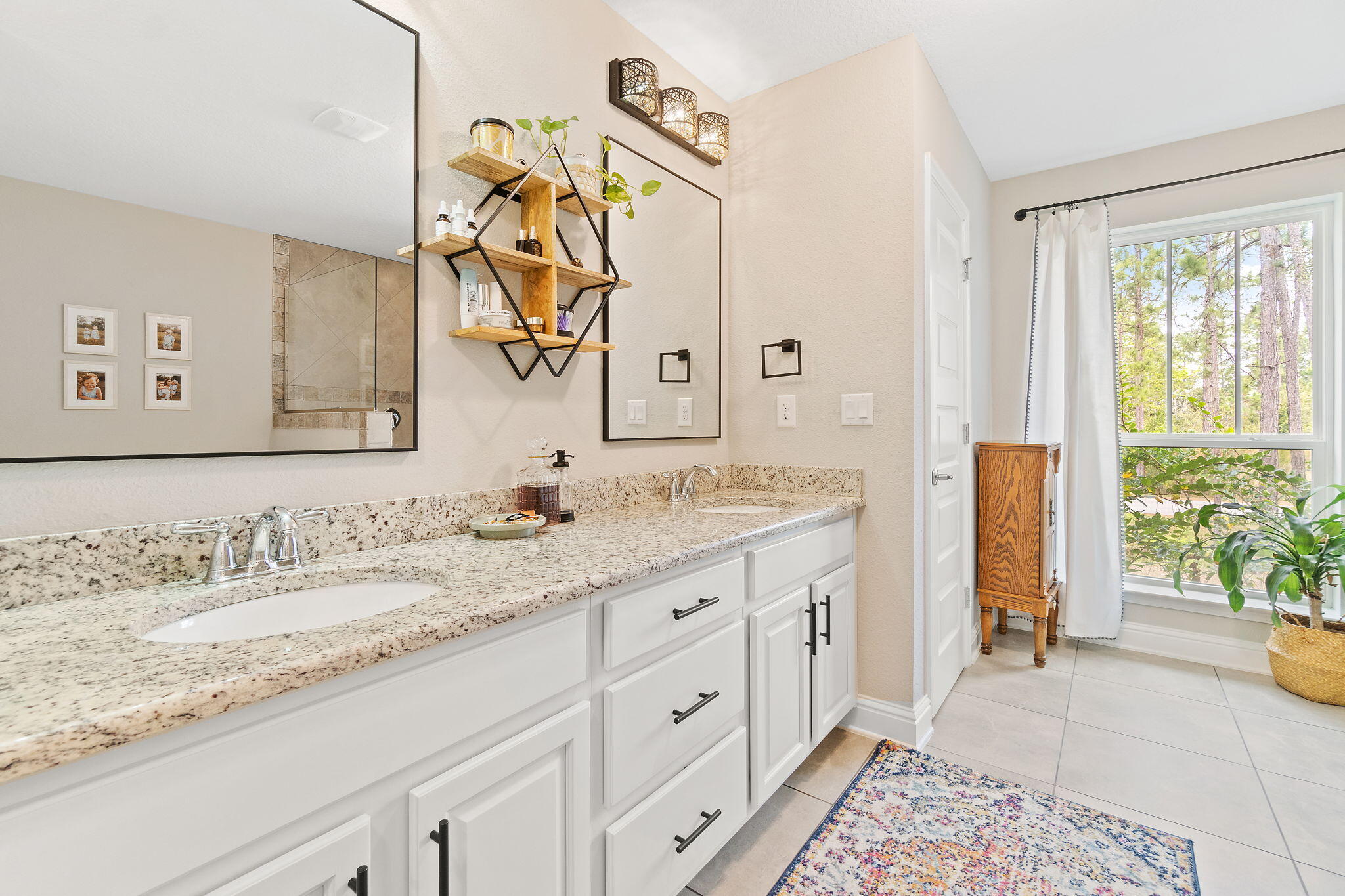 6955 Snug Waters Road Navarre, FL 32566 - Photo 36 of 45 a bathroom with a granite countertop sink and a mirror