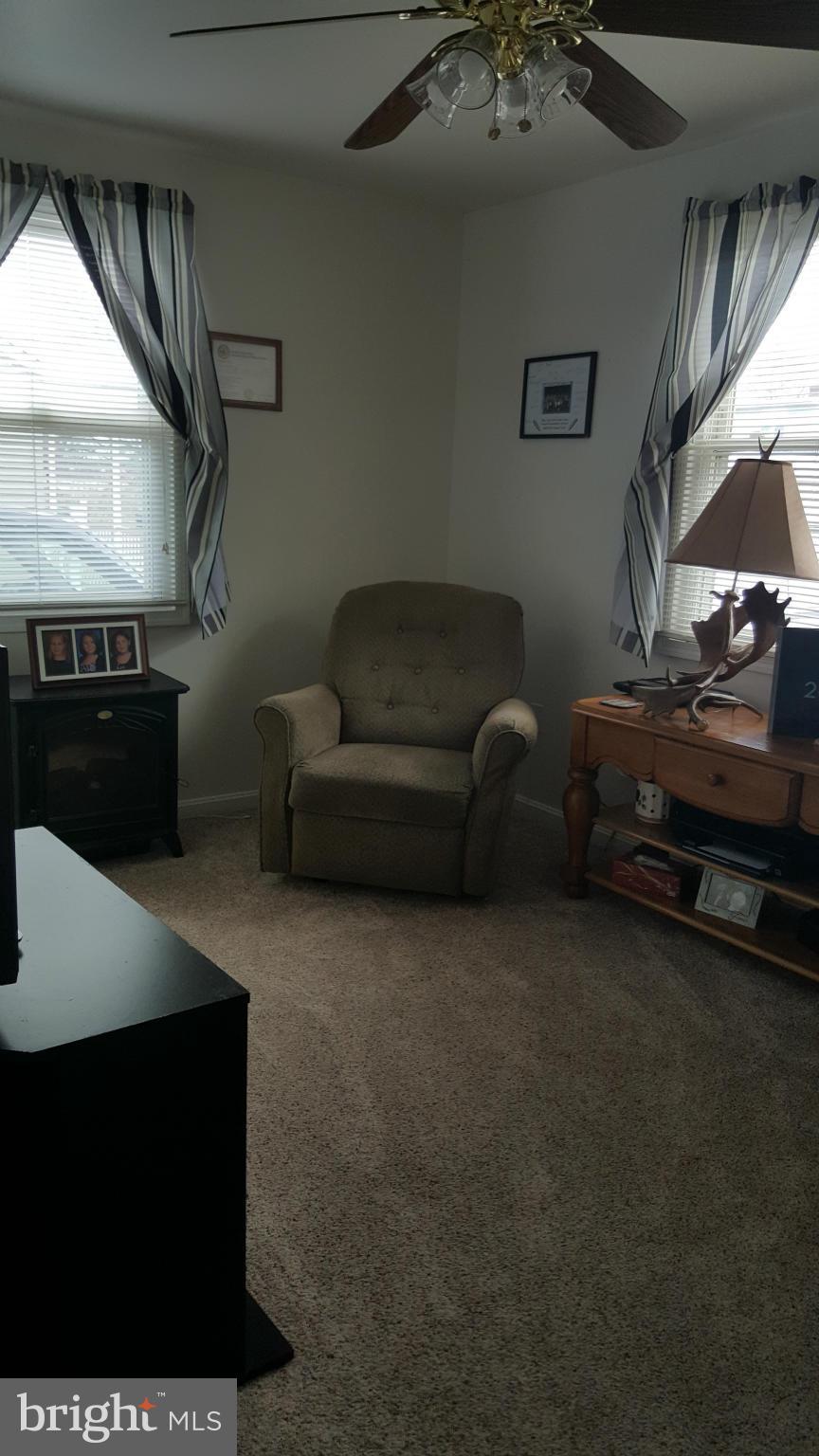8250 Longpoint Road Baltimore, MD 21222 - Photo 19 of 30 a living room with furniture and a kitchen view