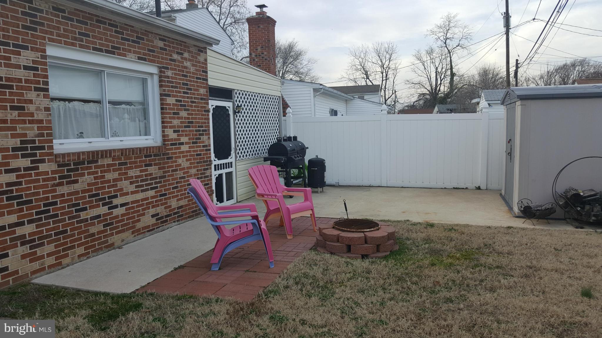 8250 Longpoint Road Baltimore, MD 21222 - Photo 23 of 30 a view of a chair and table in the backyard