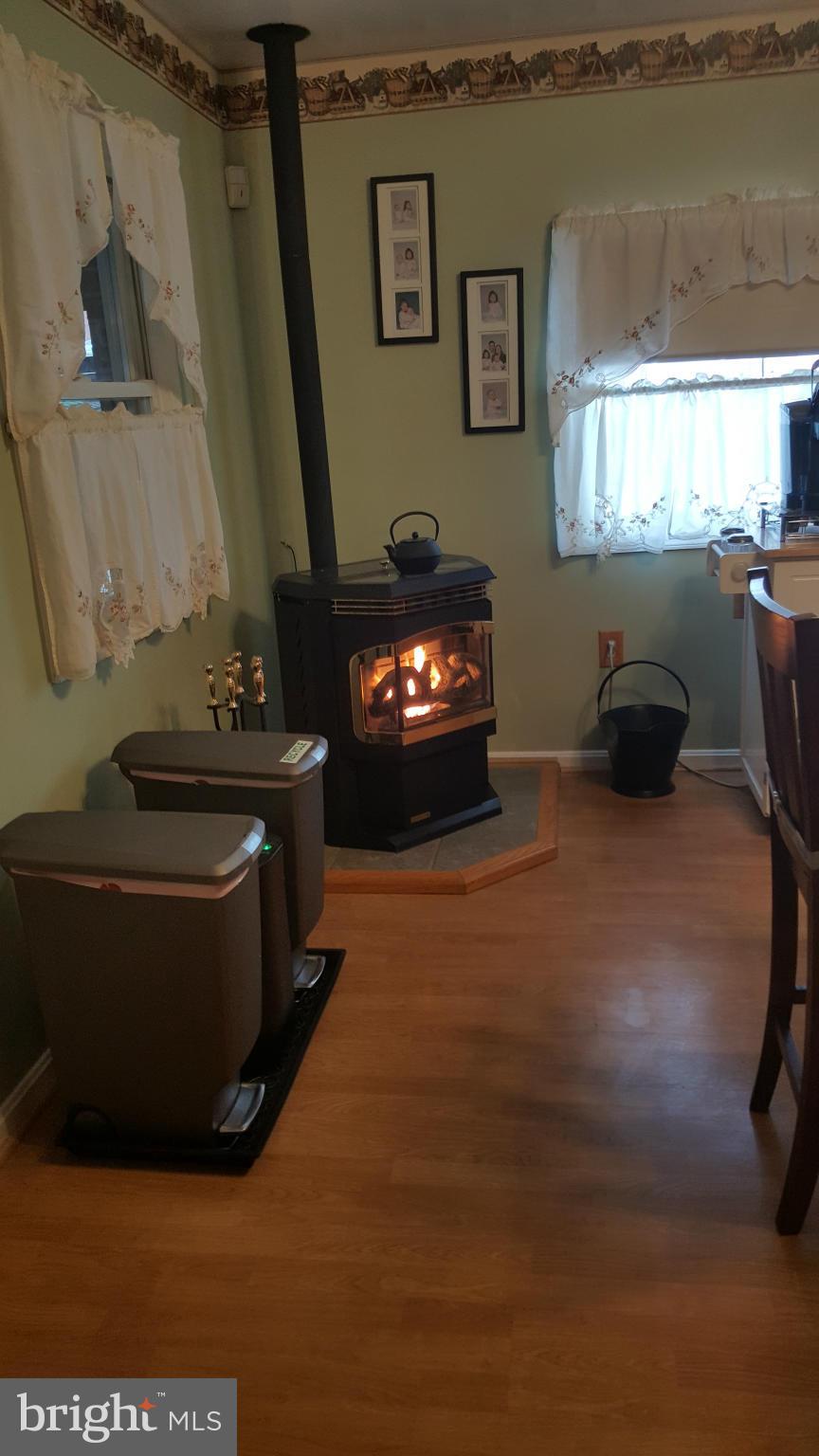 8250 Longpoint Road Baltimore, MD 21222 - Photo 5 of 30 a living room with furniture and a fireplace