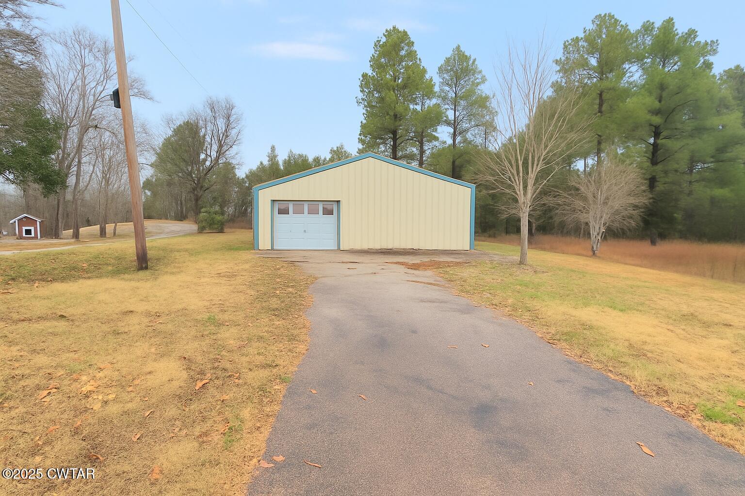 2555 Old Finger Road Finger, TN 38334 - Photo 3 of 13 a view of a yard with a house