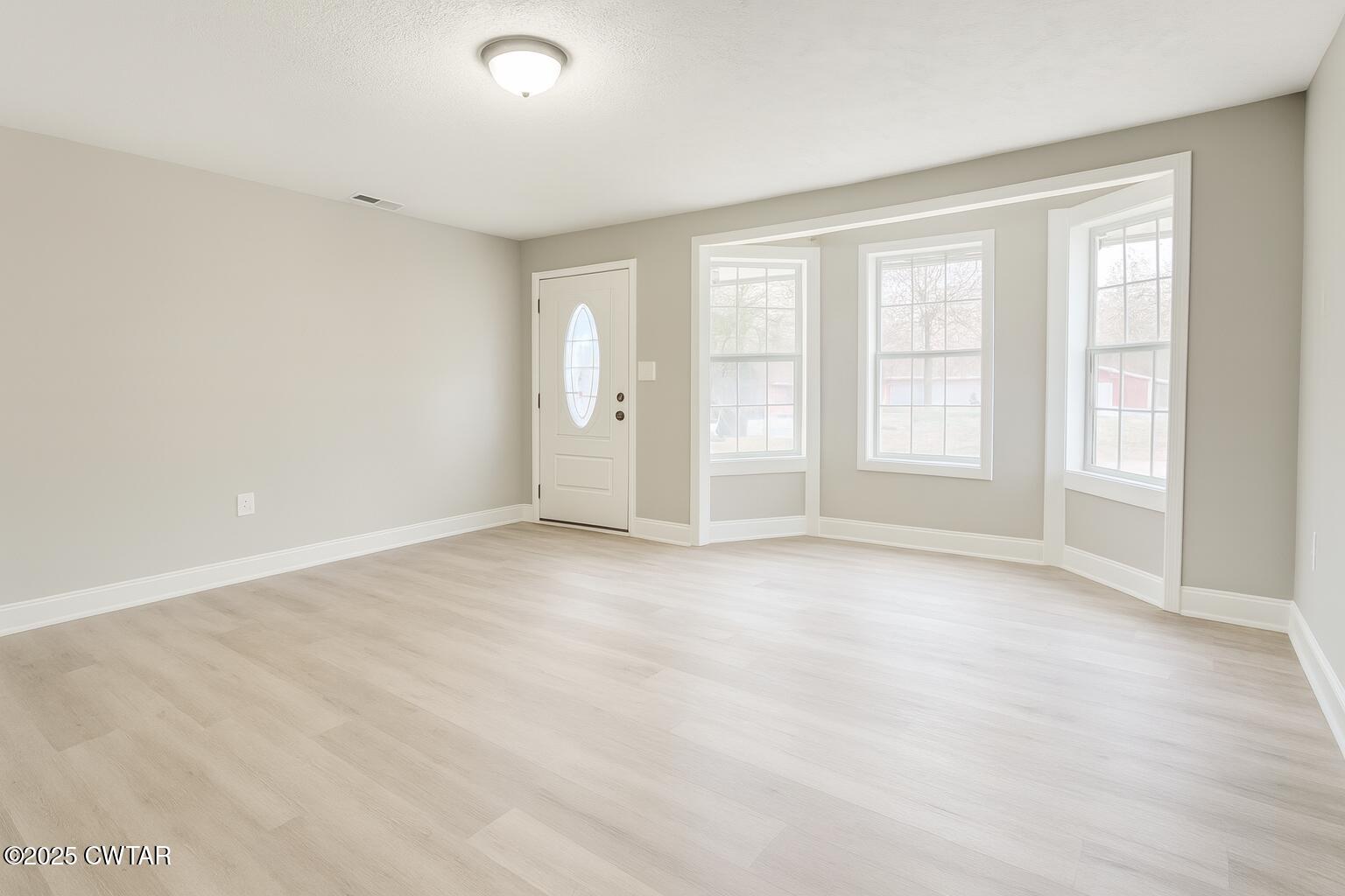 2555 Old Finger Road Finger, TN 38334 - Photo 4 of 13 an empty room with windows
