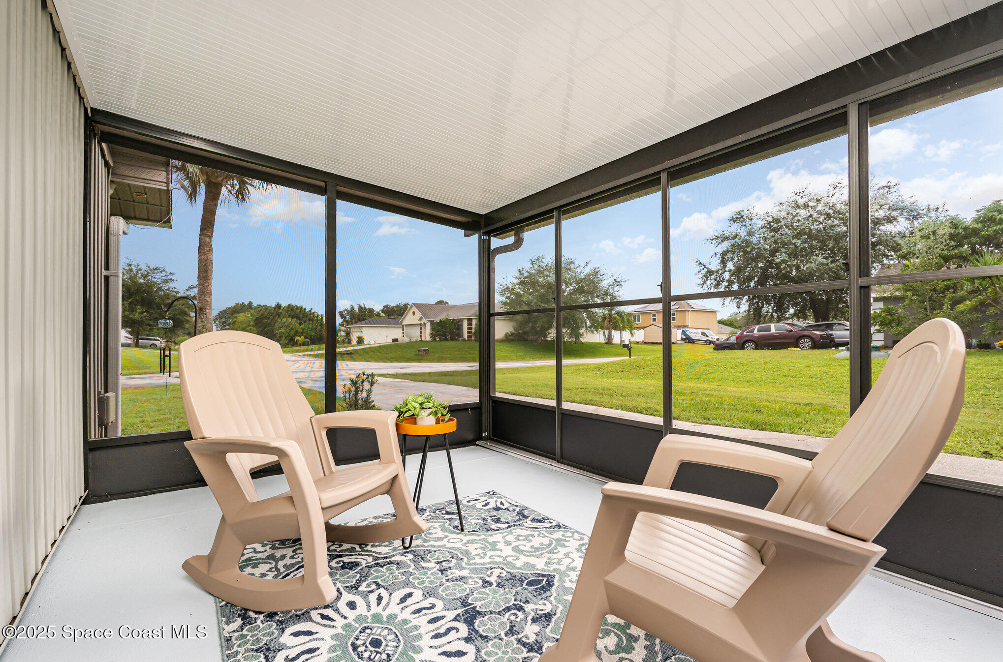 1095 Dorchester Road Palm Bay, FL 32907 - Photo 16 of 26 a view of a porch with furniture and garden