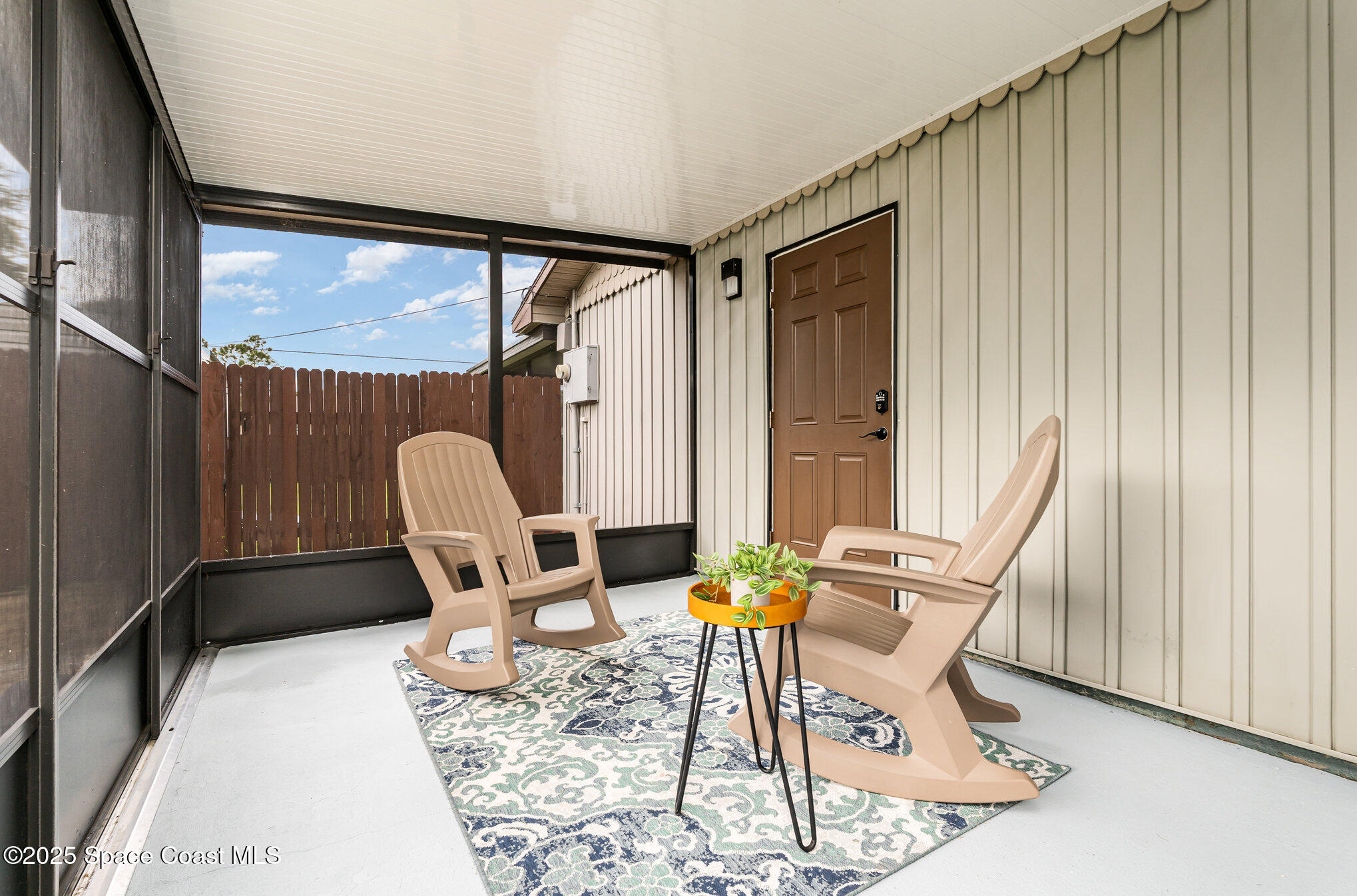 1095 Dorchester Road Palm Bay, FL 32907 - Photo 17 of 26 a work room with furniture and a window