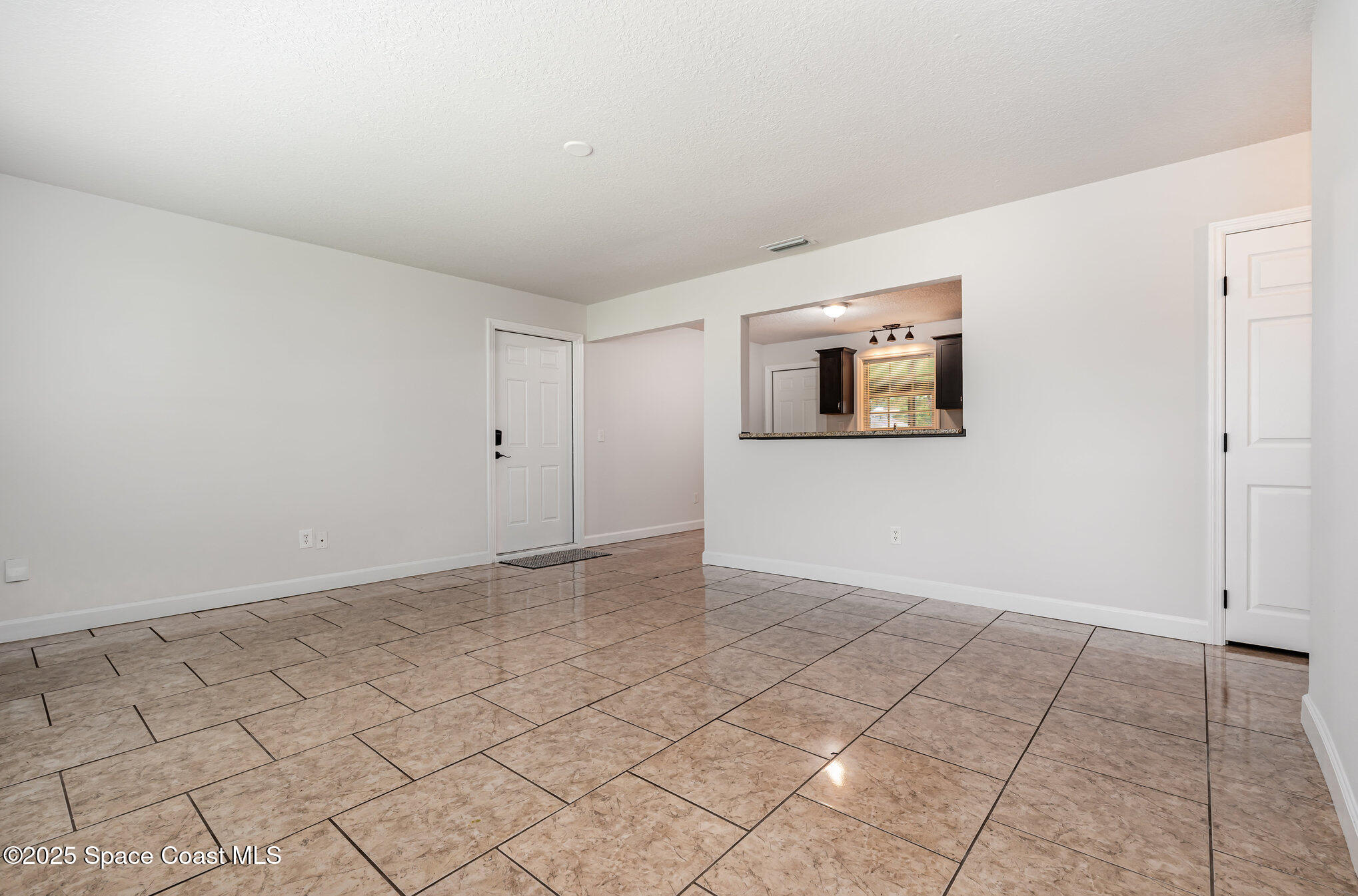 1095 Dorchester Road Palm Bay, FL 32907 - Photo 7 of 26 a view of an empty room