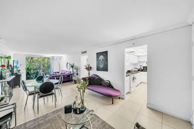 a kitchen with refrigerator and cabinets