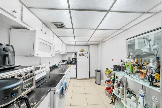 a kitchen with a stove and a refrigerator