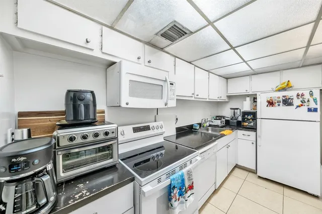 a storage room with lots of furniture and clutter
