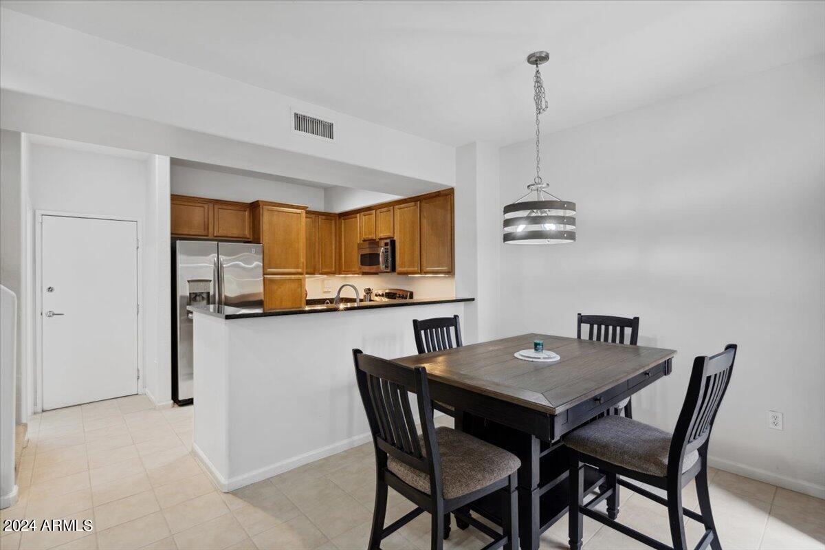 3935 East Rough Rider Road, Unit 1062 Phoenix, AZ 85050 - Photo 9 of 50 09-Dining Room