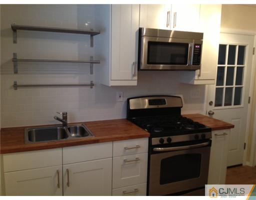 82 Princeton Road Old Bridge, NJ 08859 - Photo 3 of 6 a kitchen with a sink and steel appliances