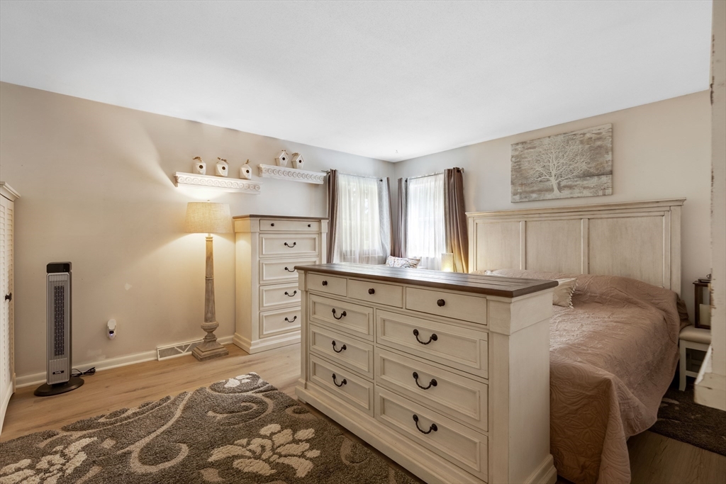 15 Conestoga Road Lexington, MA 02421 - Photo 11 of 31 a bedroom with a bed and a dresser