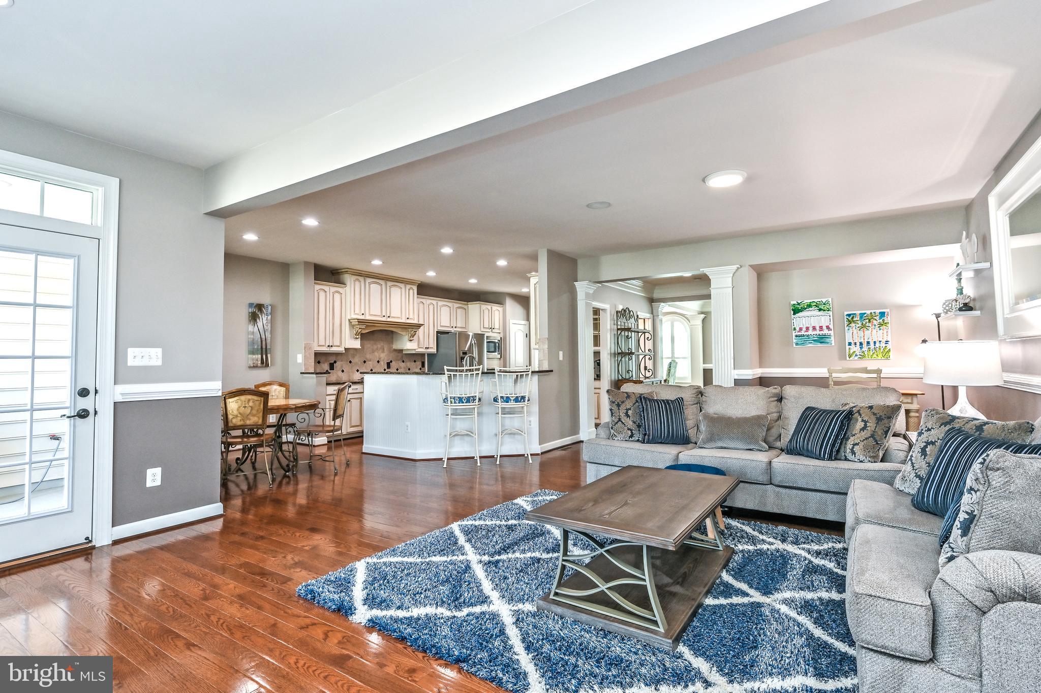 24947 Earlsford Drive Chantilly, VA 20152 - Photo 15 of 40 a living room with furniture kitchen view and a wooden floor