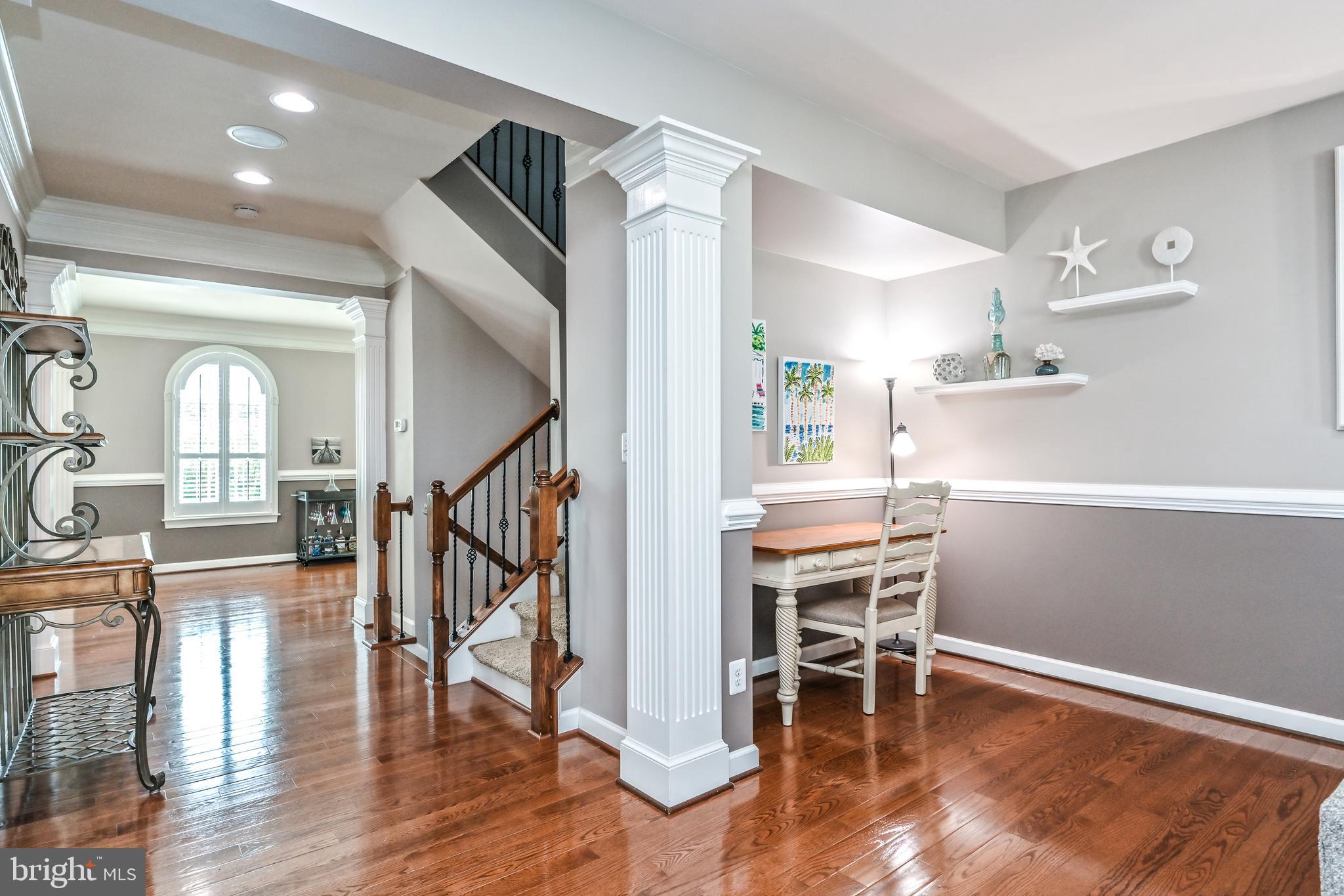 24947 Earlsford Drive Chantilly, VA 20152 - Photo 16 of 40 a workspace with wooden floor and entryway