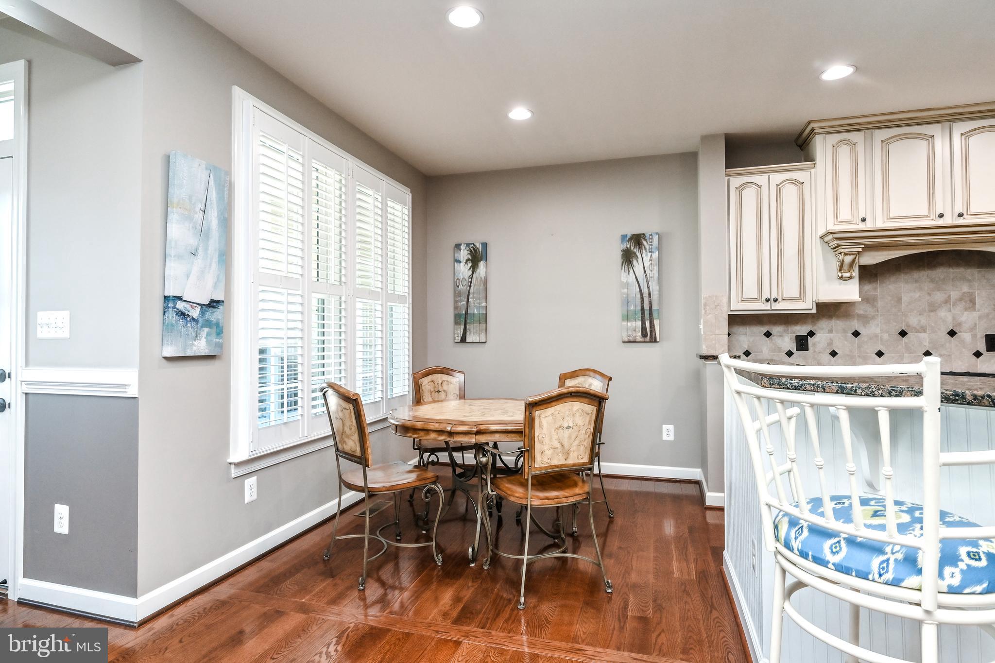 24947 Earlsford Drive Chantilly, VA 20152 - Photo 18 of 40 a view of a dining room with furniture and chandelier