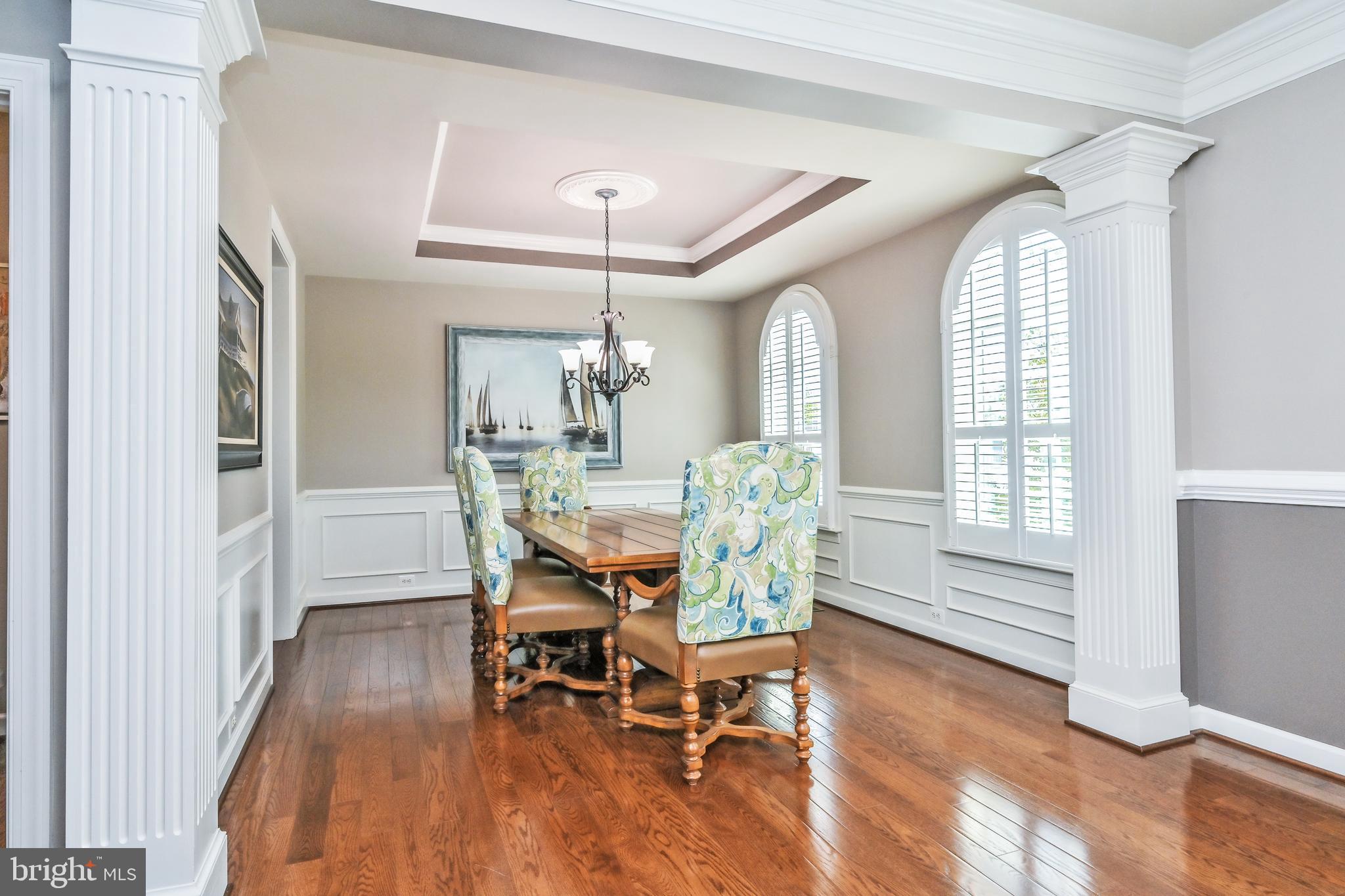 24947 Earlsford Drive Chantilly, VA 20152 - Photo 26 of 40 a view of a dining room with furniture and wooden floor
