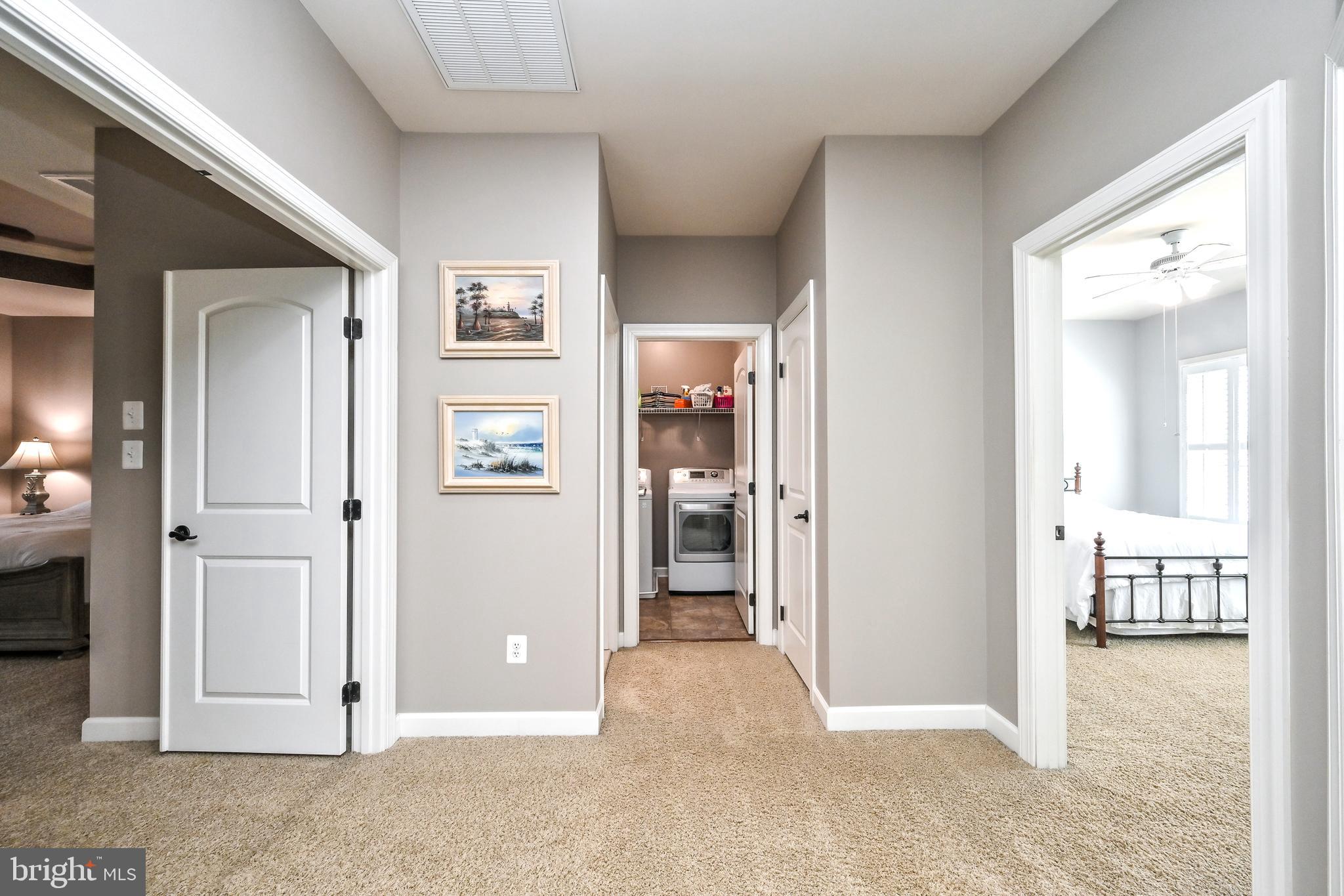 24947 Earlsford Drive Chantilly, VA 20152 - Photo 29 of 40 hallway with wooden floor and windows