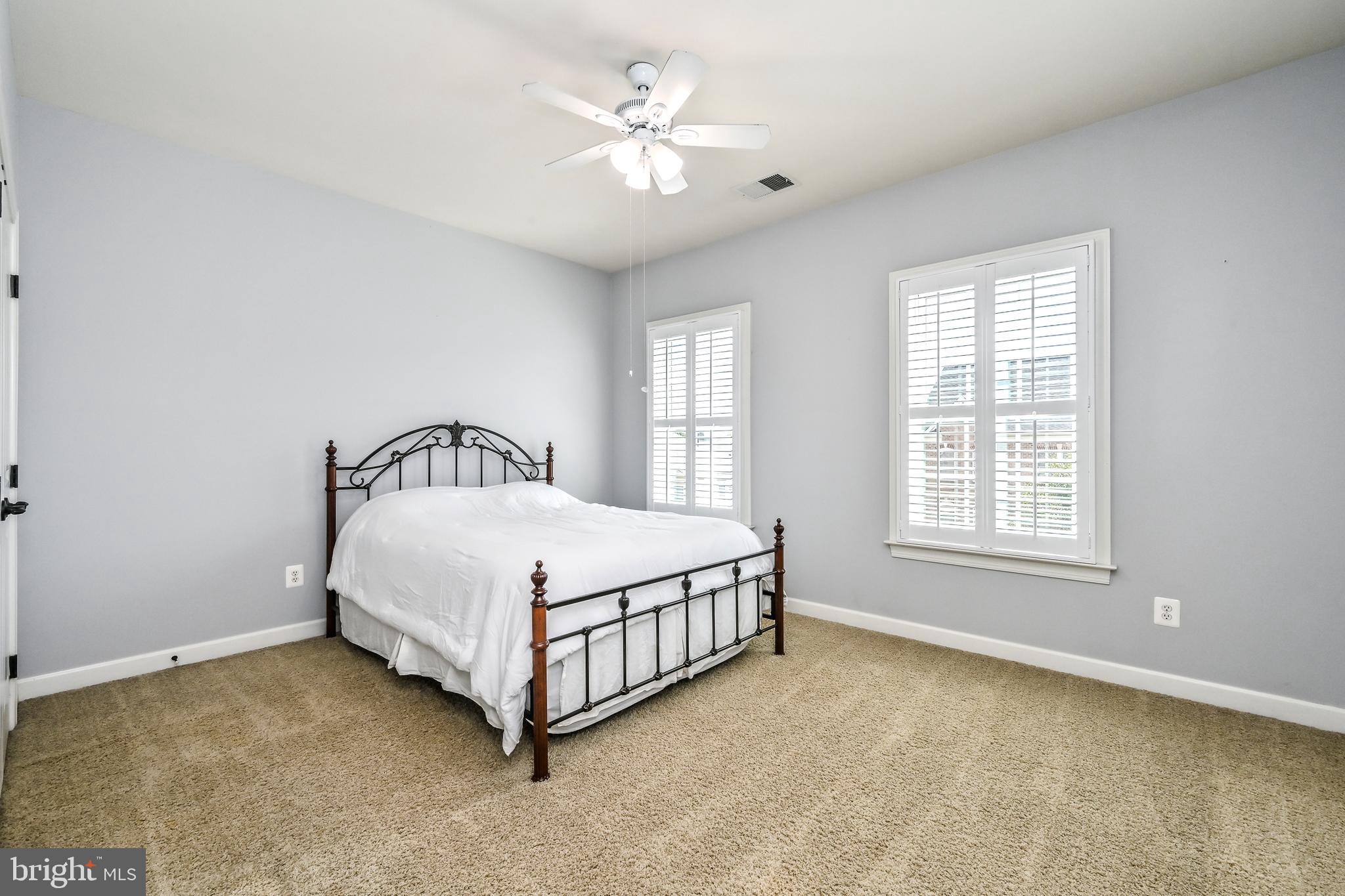 24947 Earlsford Drive Chantilly, VA 20152 - Photo 33 of 40 a spacious bedroom with a bed and a window