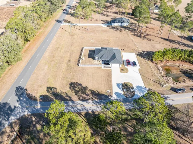an aerial view of residential house with outdoor space