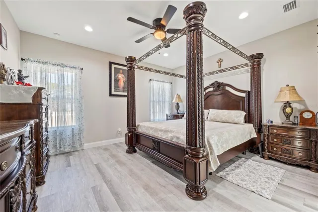 a bed room with a bed and a mirror