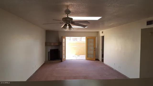 a kitchen with stainless steel appliances a sink a stove top oven a counter space and cabinets