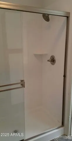 a view of an empty room and a window