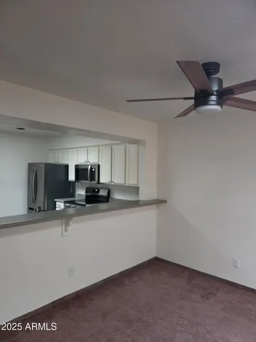 a stove top oven sitting inside of a kitchen