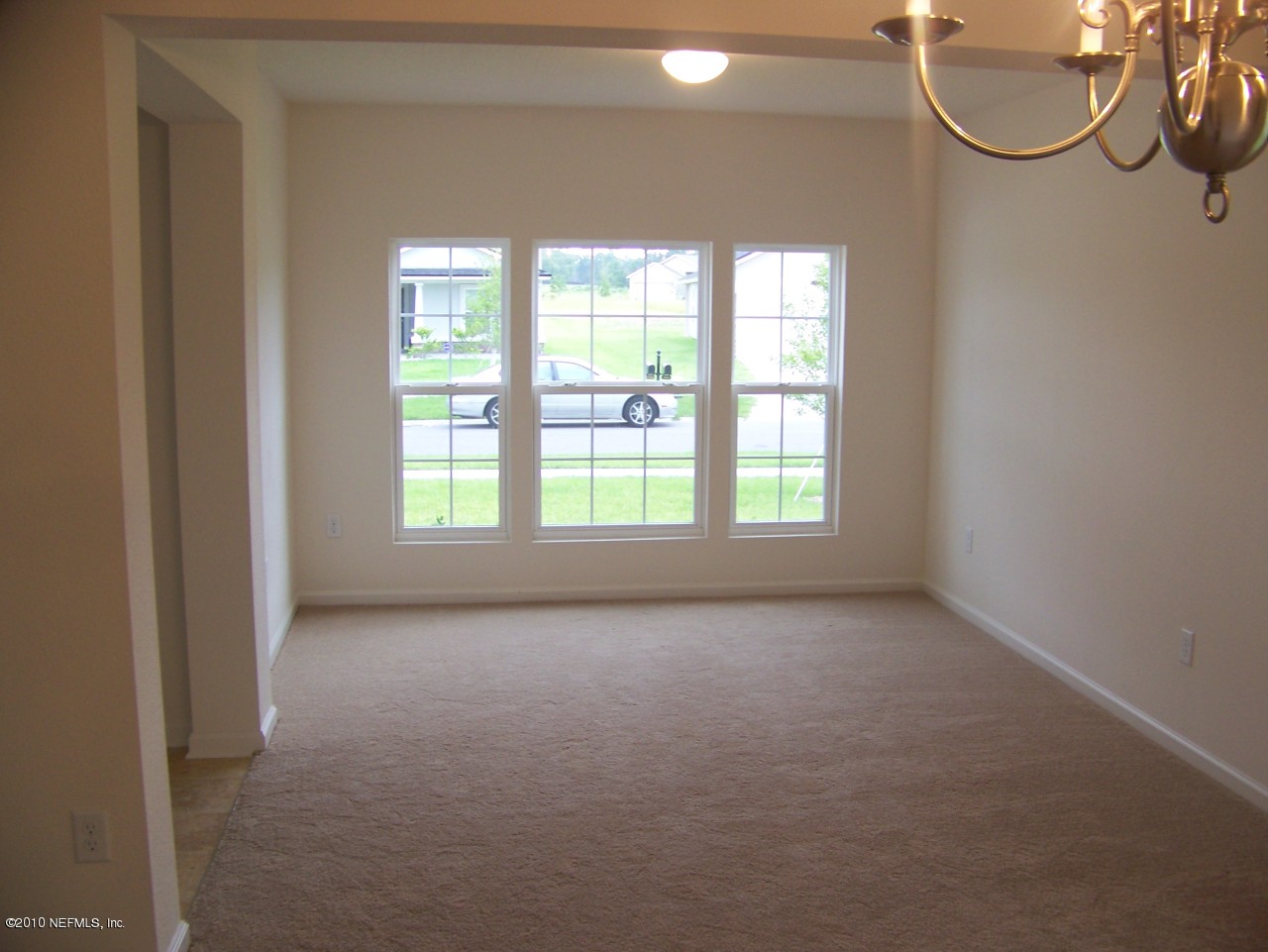 1867 Reed Valley Way, Unit AZALEA RIDGE LOT 133 Middleburg, FL 32068 - Photo 11 of 17 a view of a room with windows