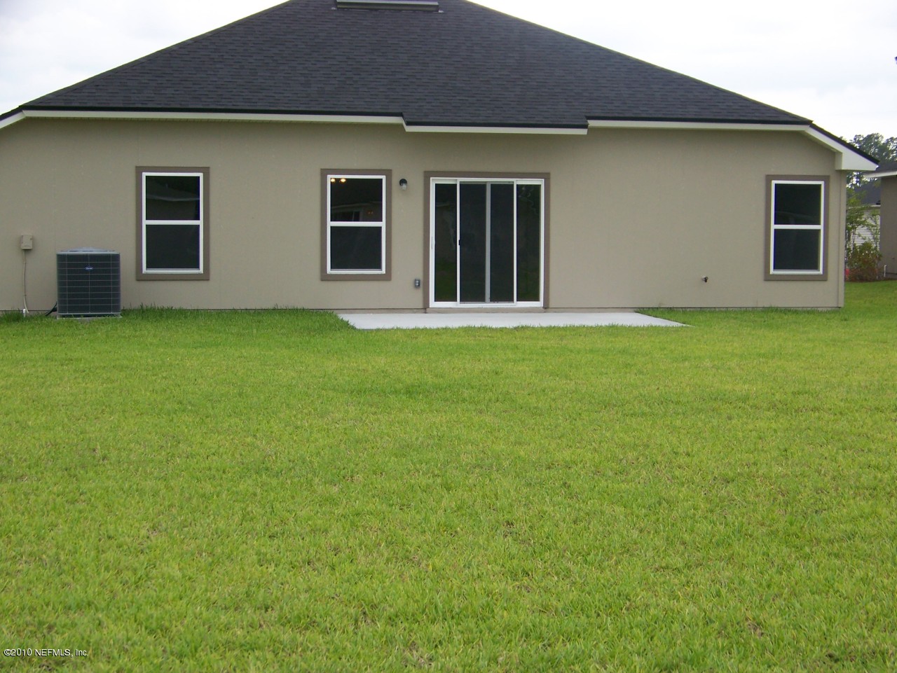 1867 Reed Valley Way, Unit AZALEA RIDGE LOT 133 Middleburg, FL 32068 - Photo 14 of 17 a house that has a big yard