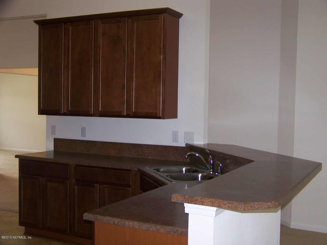 1867 Reed Valley Way, Unit AZALEA RIDGE LOT 133 Middleburg, FL 32068 - Photo 5 of 17 a kitchen with a sink and cabinets