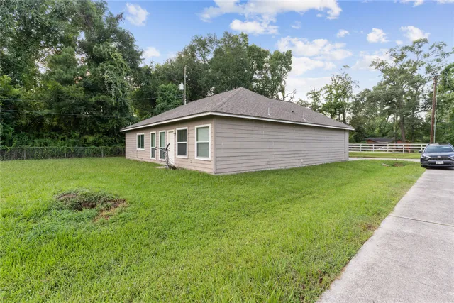a backyard of a house with lots of green space