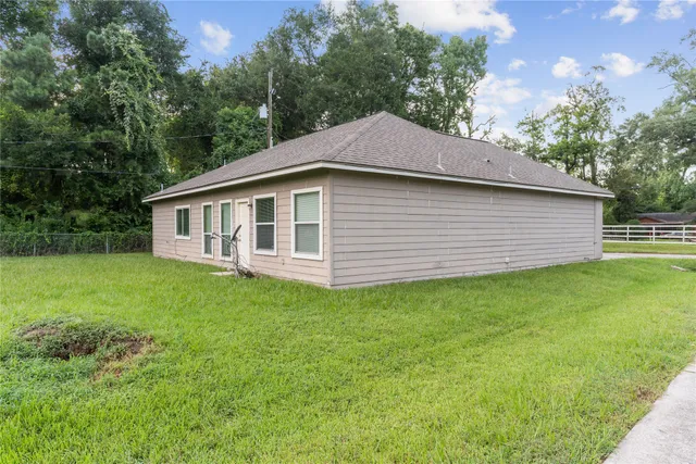 a view of a park with iron fence