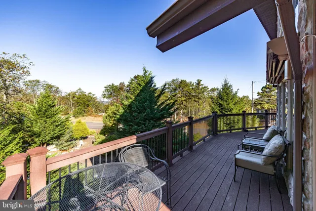 a kitchen with stainless steel appliances granite countertop a stove refrigerator and microwave