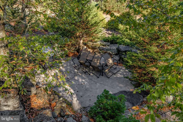 a open kitchen with stainless steel appliances granite countertop a stove and a refrigerator
