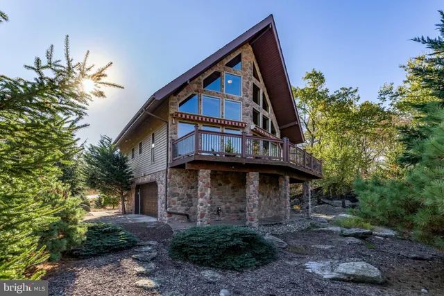 a aerial view of a house with a flower garden