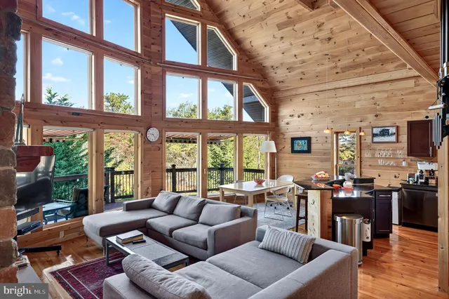 a view of a hallway with entryway wooden floor and front door