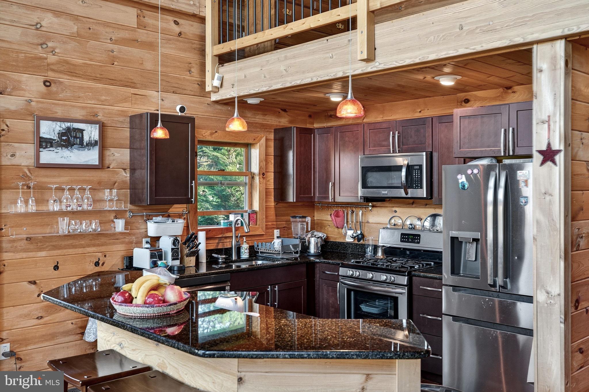 29 Blackhawk Boulevard Hazleton, PA 18202 - Photo 34 of 109 a kitchen with stainless steel appliances granite countertop a stove refrigerator and microwave