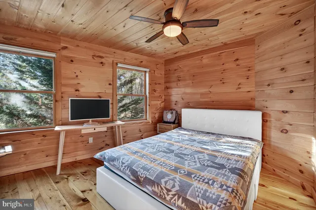 a view of yard with swimming pool and trees