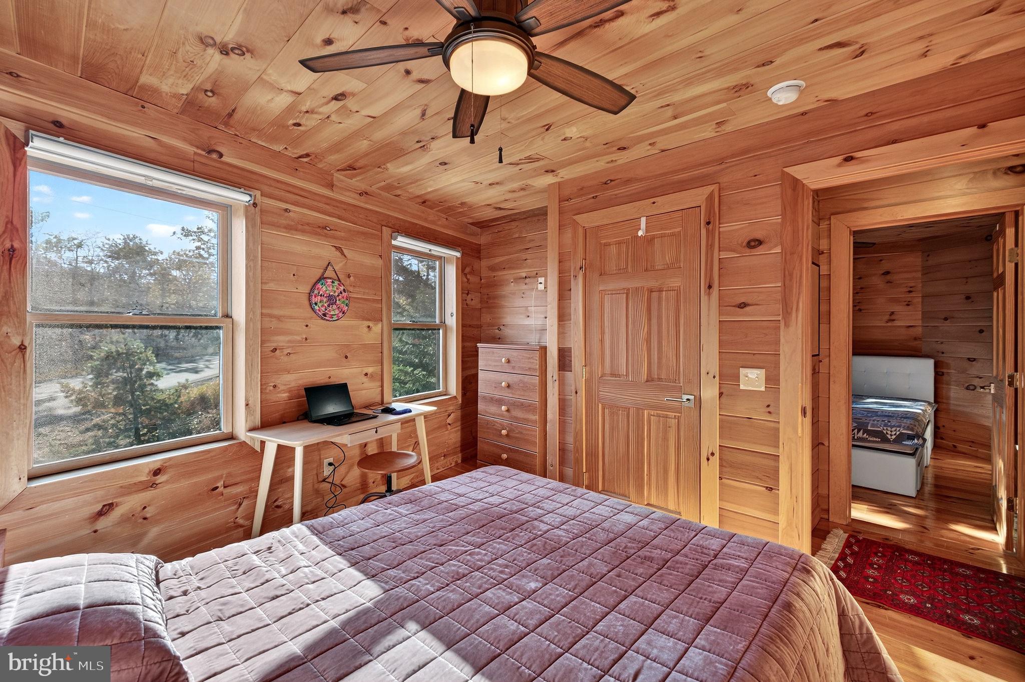 29 Blackhawk Boulevard Hazleton, PA 18202 - Photo 47 of 109 a bedroom with a bed and a large window with a flat tv screen