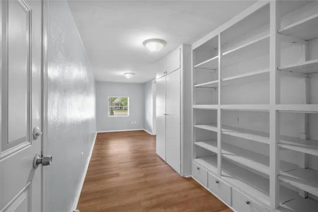 a view of a hallway with closet