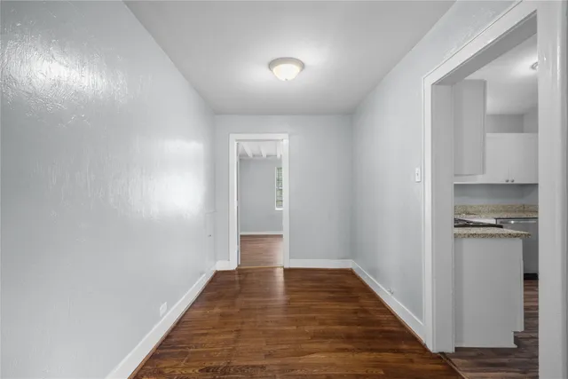 a view of a kitchen from the hallway