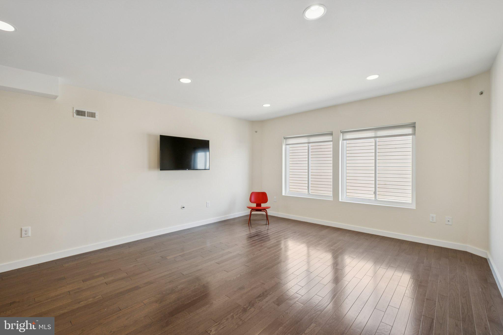 1189 South 21st Street Philadelphia, PA 19146 - Photo 13 of 30 a view of empty room with wooden floor and window